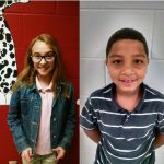 Boys and girl smiling looking at camera
