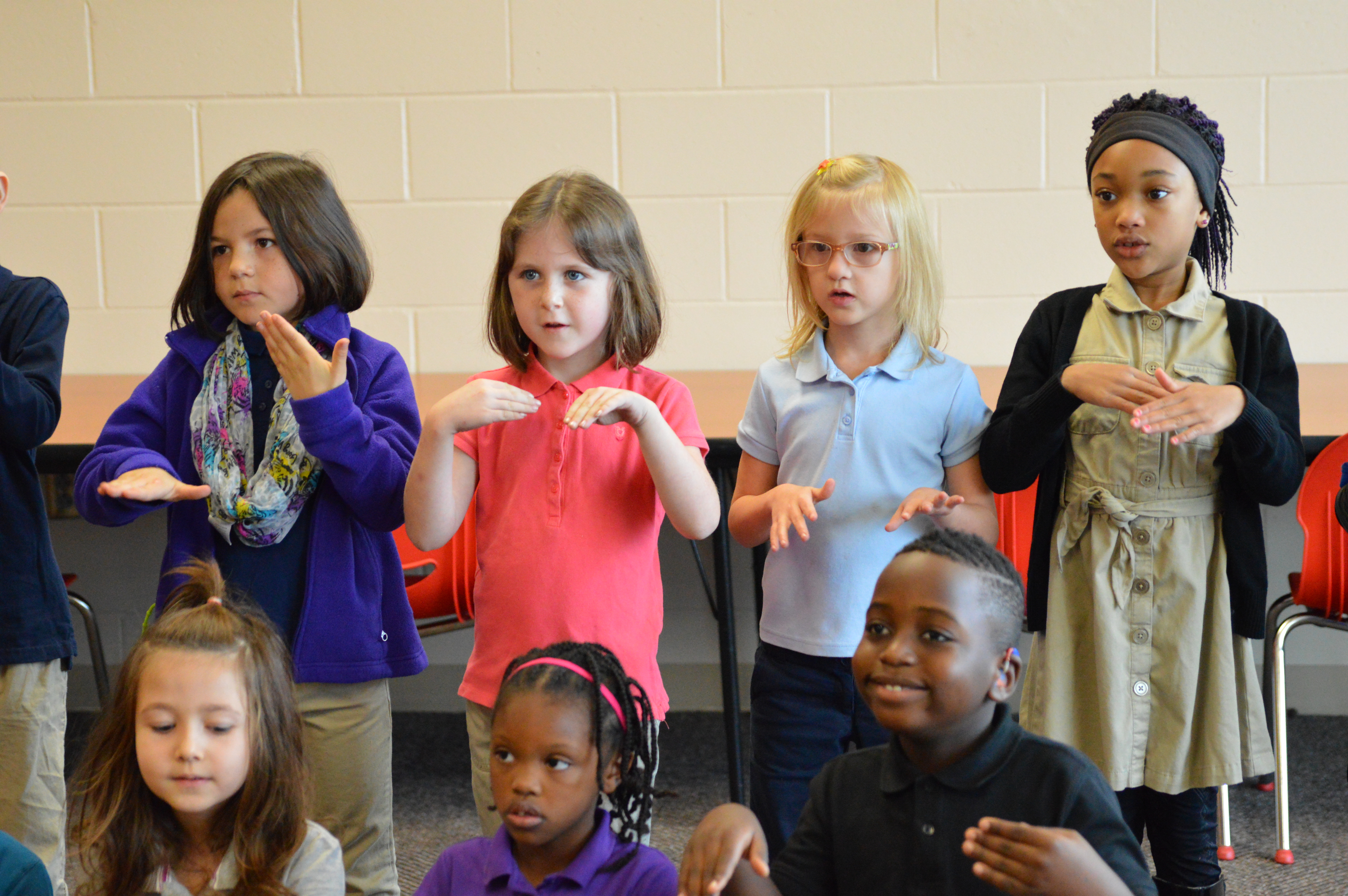 students using sign language