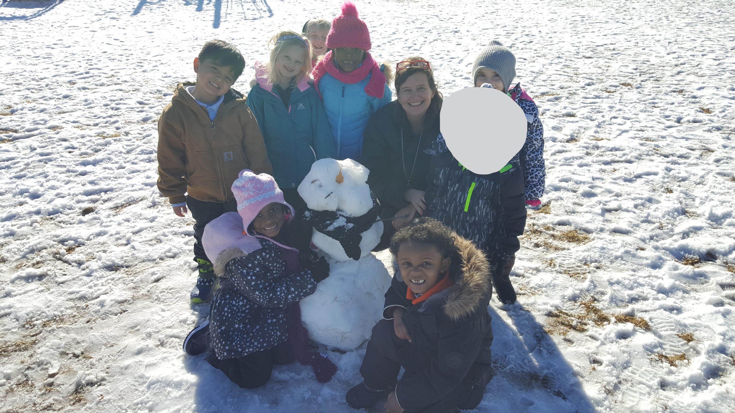 image of snowman, students, and teacher