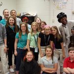 The Brazilian Twins musicians pose with Bunger chorus students.