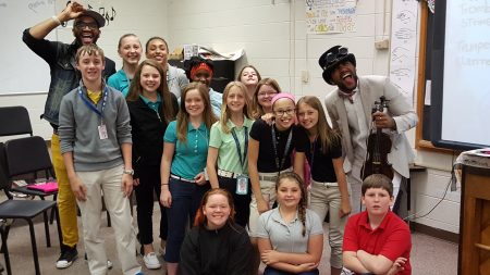 Brazilian Twins musicians pose with Bunger chorus students.