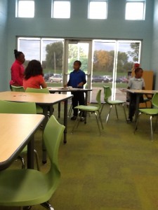 4 students working together at their table to find answers