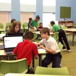 Elementary children working on computers during Skype session