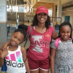 Parent and children smiling at Family Night