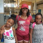 Parent and children smiling at Family Night