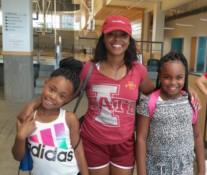 Parent and children smiling at Family Night