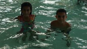 Two Students swimming during Family Night